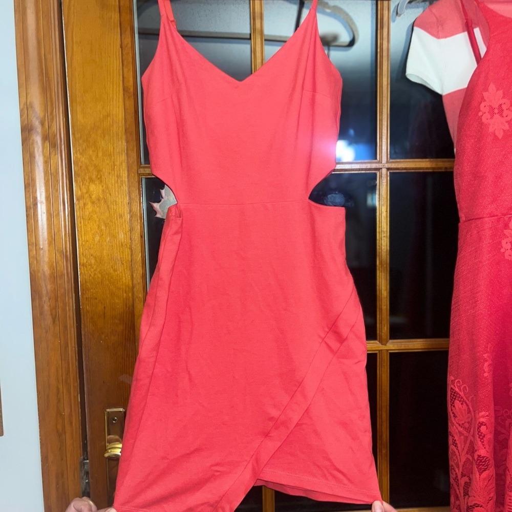 BEBE brand new dress with sides cut out. Size small